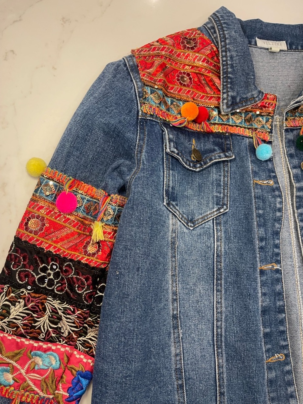 Velzera Women’s Denim Jacket with Multicolor Embroidered Panels and Pom-Poms - Picture 7 of 16